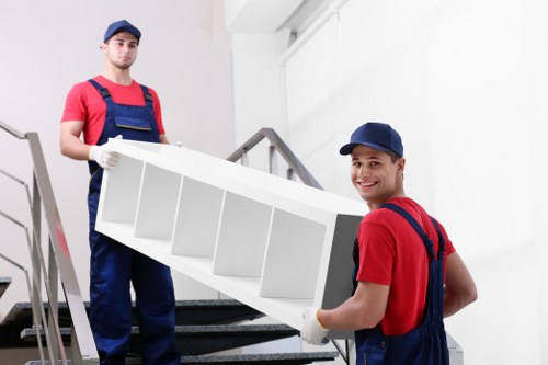 Professional movers handling flat access in West London