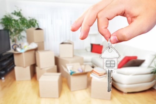 Preparing boxes and furniture for a moving van in Earls Court