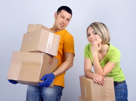 Packed moving boxes and furniture for a local relocation