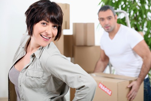 Professional moving team loading furniture for a flat move in Earls Court