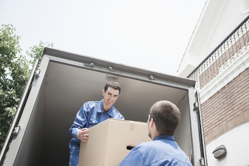 Organised office move process with boxes, desks, and equipment ready for transport