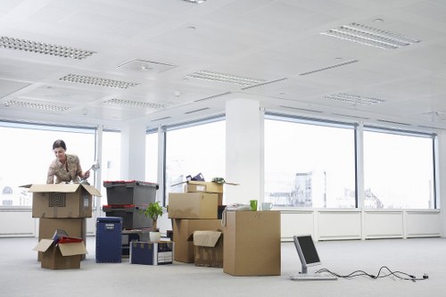 Packed boxes and moving equipment ready for an Earls Court removal