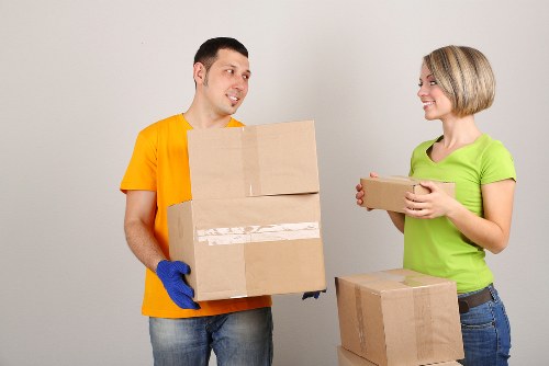 Local moving team handling furniture near Earls Court flats