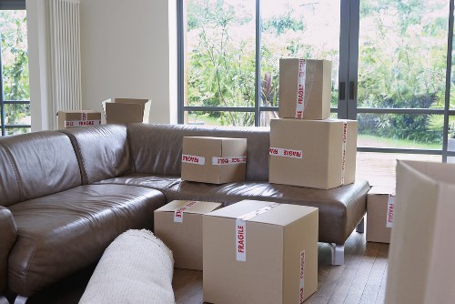 Packed boxes and furniture ready for local transport in Earls Court