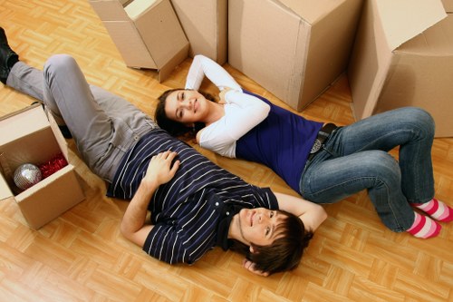 Local team loading sofas and tables for furniture pick-up in Earls Court