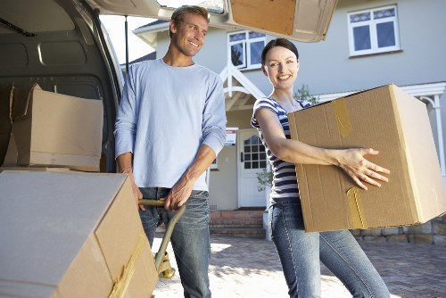 Unpacking support helping a family settle into an Earls Court property